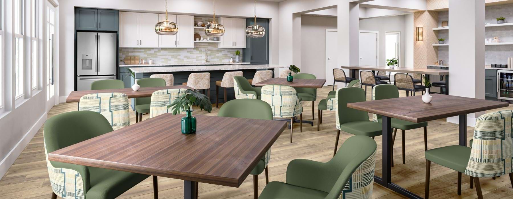 a resident kitchen with tables and chairs at Amberlin South Naples in Naples, Florida