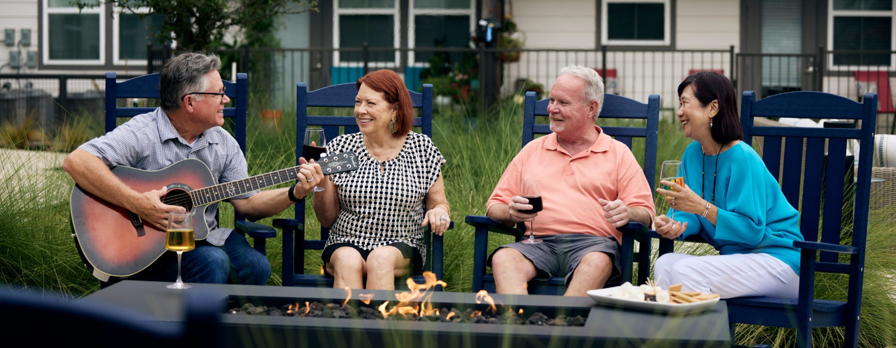 people sitting around a camp fire